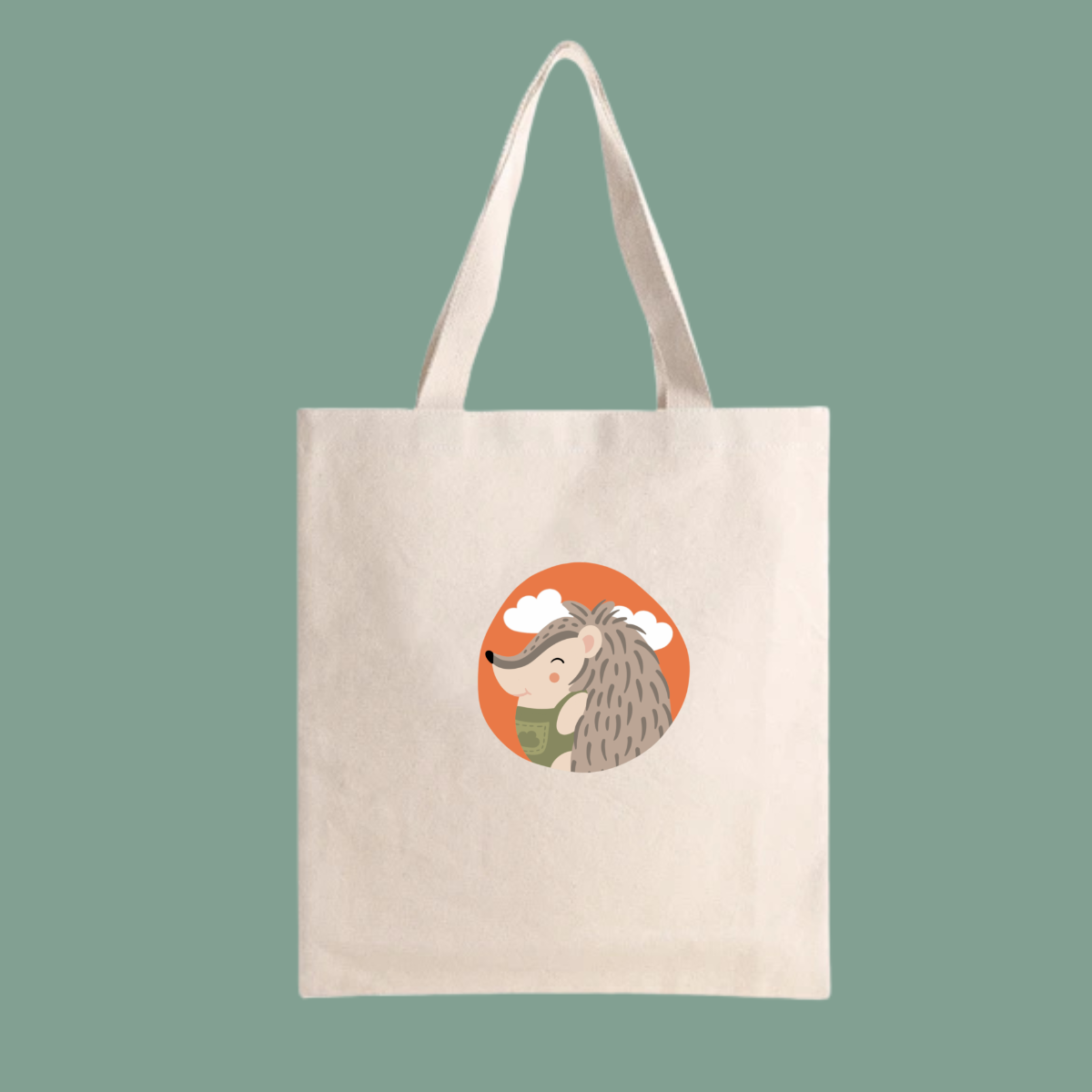 Bolsa Tote Bag color beige con estampado retrato del puercoespin Filomeno con un traje verde de la marca de ropa nube dentro de un círculo naranja con nubes.