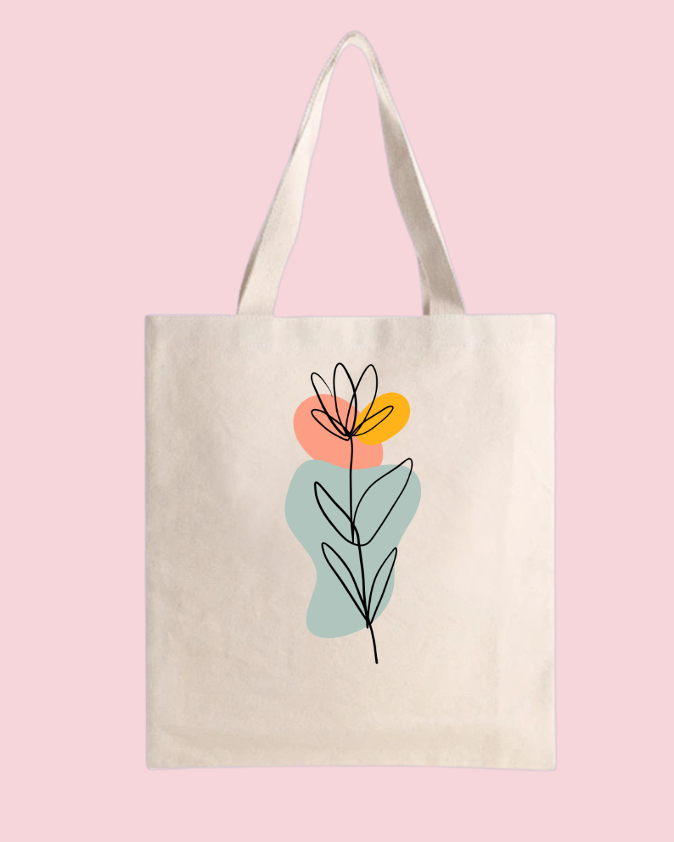 bolsa de manta tote bag con flor trazada y detalles verde rosa y naranja